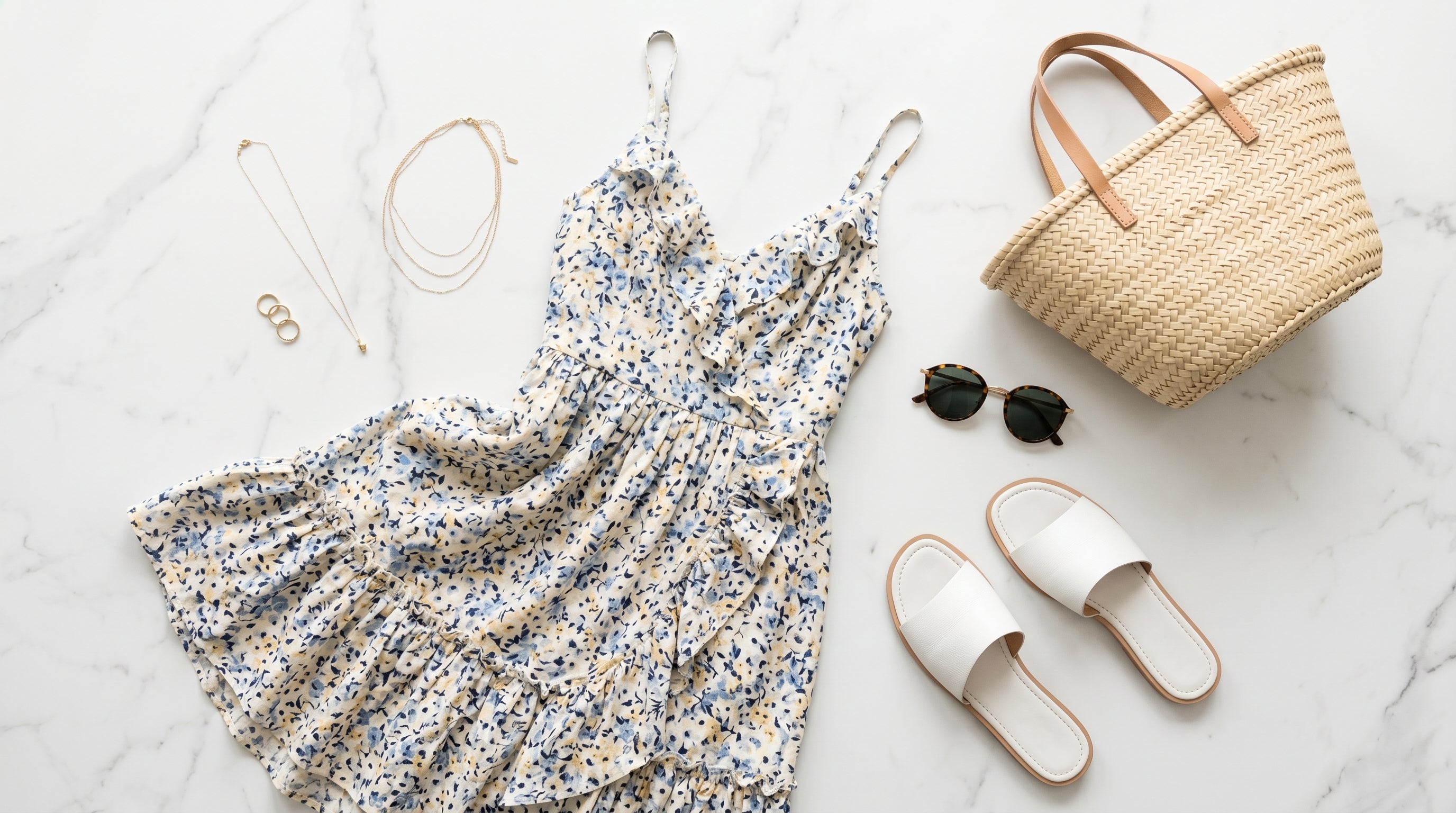Summer outfit flat-lay with sundress sandals and accessories