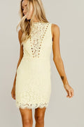 A romantic light yellow mini dress featuring intricate lace detail, high neckline, and a fitted sleeveless silhouette.