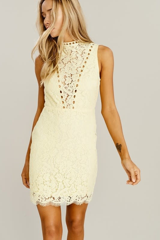 A romantic light yellow mini dress featuring intricate lace detail, high neckline, and a fitted sleeveless silhouette.
