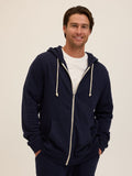 Men's navy blue triblend fleece zip hoodie with off-white drawstrings in a minimalist athletic style