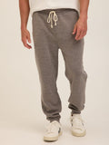 Man wearing comfortable grey triblend fleece joggers with a modern straight leg fit