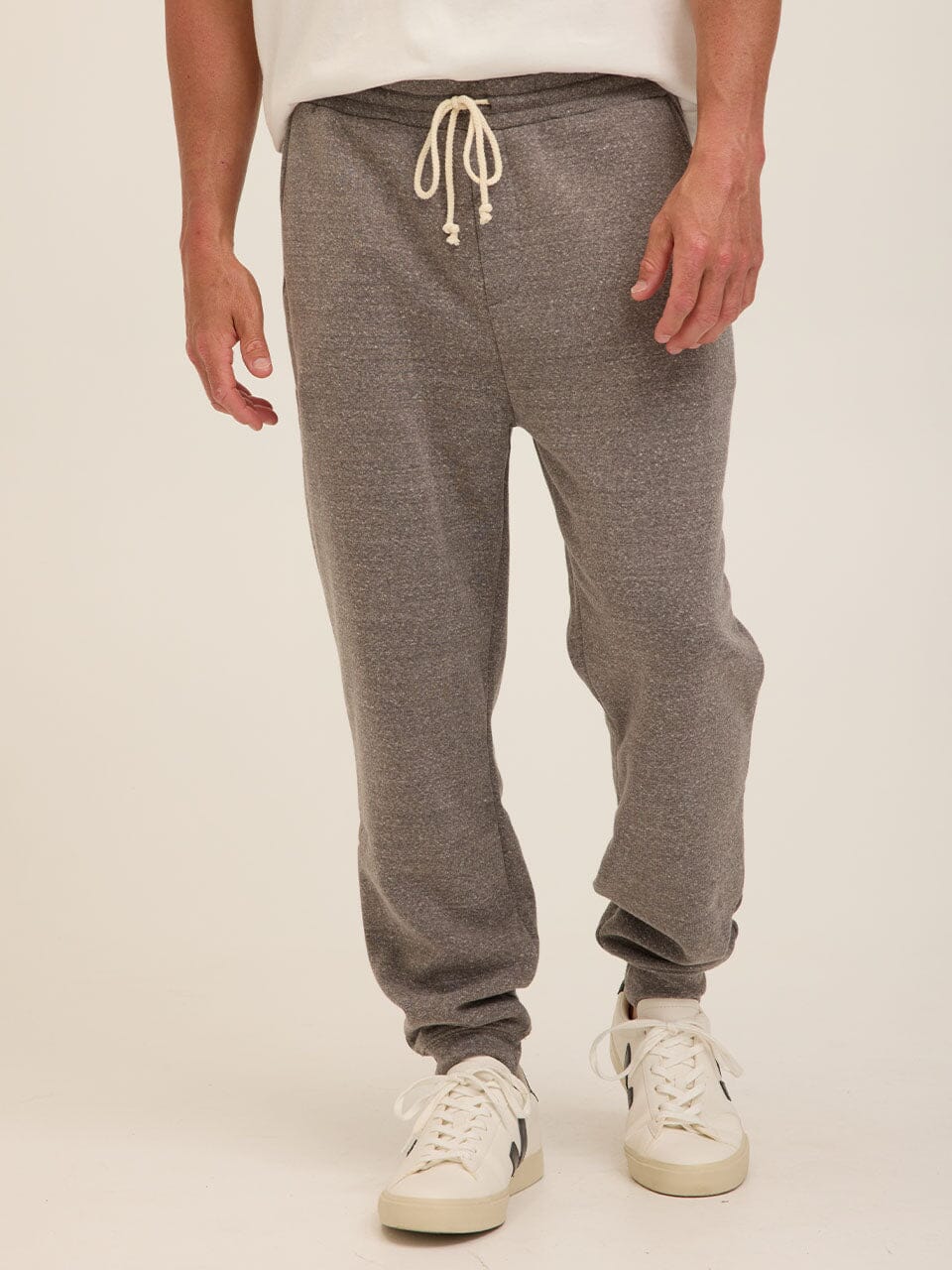 Man wearing comfortable grey triblend fleece joggers with a modern straight leg fit