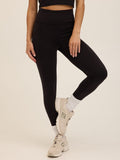 Model wearing black Sculpted Fit Leggings with a minimalist, sporty aesthetic.