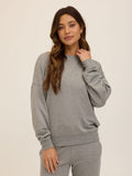 Close up of the Core Feather Fleece Sweatshirt in Grey showing the soft knit texture and relaxed fit.