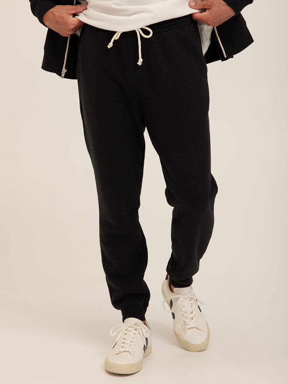 Men wearing black Core Triblend Fleece Joggers in a modern tapered fit