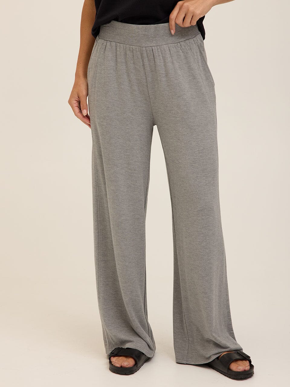 Core Feather Fleece wide-leg sweatpants in a soft, fluid fabric with an elastic waistband and side pockets.
