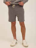 Men wearing comfortable grey triblend fleece shorts with side pockets and an adjustable drawstring waistband.