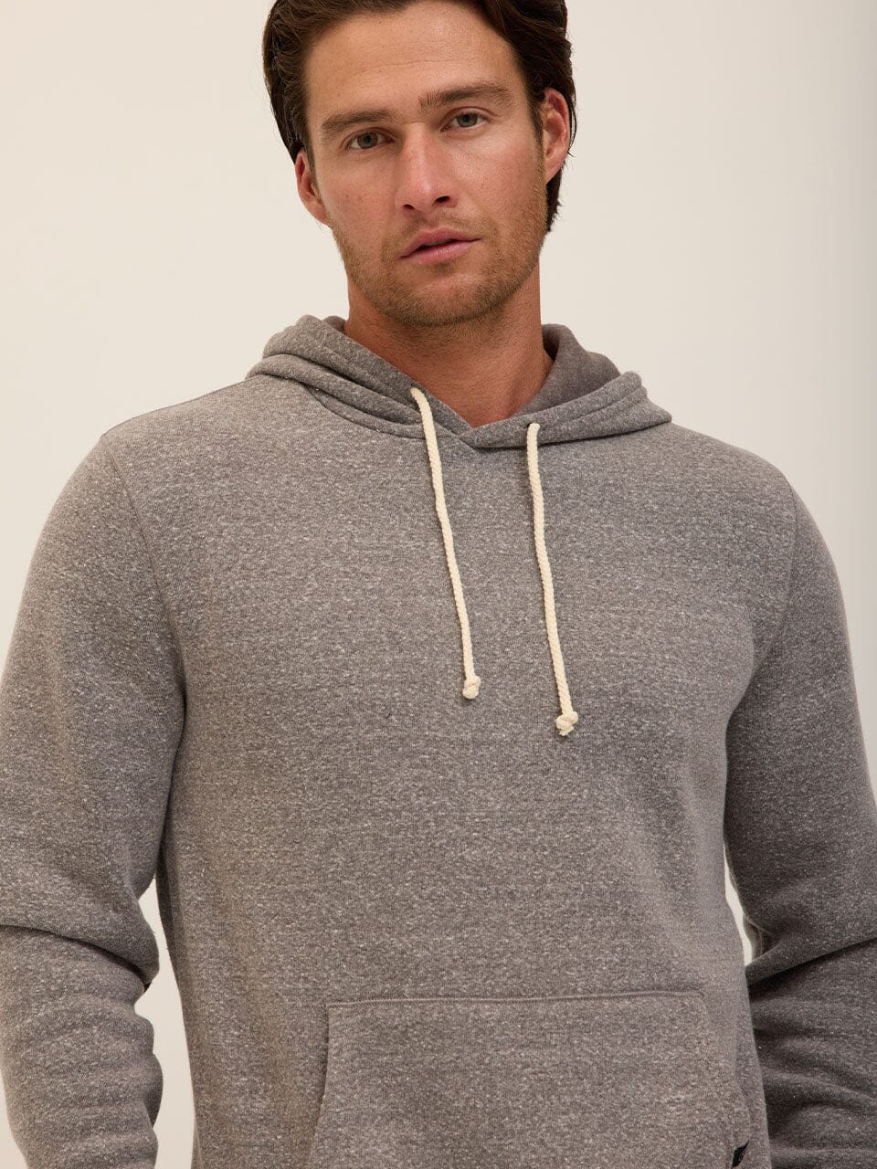 Men's Core Triblend Fleece Pullover Hoodie in grey, minimalist design.