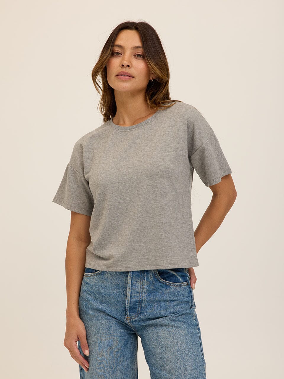 Women wearing a minimalist grey Core Modal Terry Crew Neck Tee with a subtle drape
