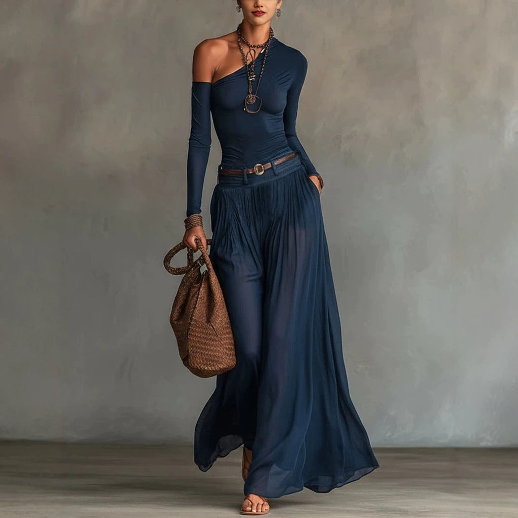 Asymmetrical shoulder long sleeve A-line maxi dress with a waist belt.