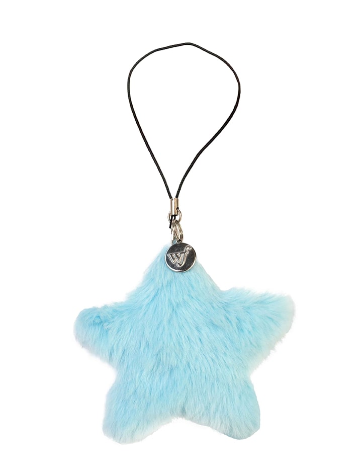 A light blue fluffy star-shaped phone charm with a silver branded tag and a black loop attachment.