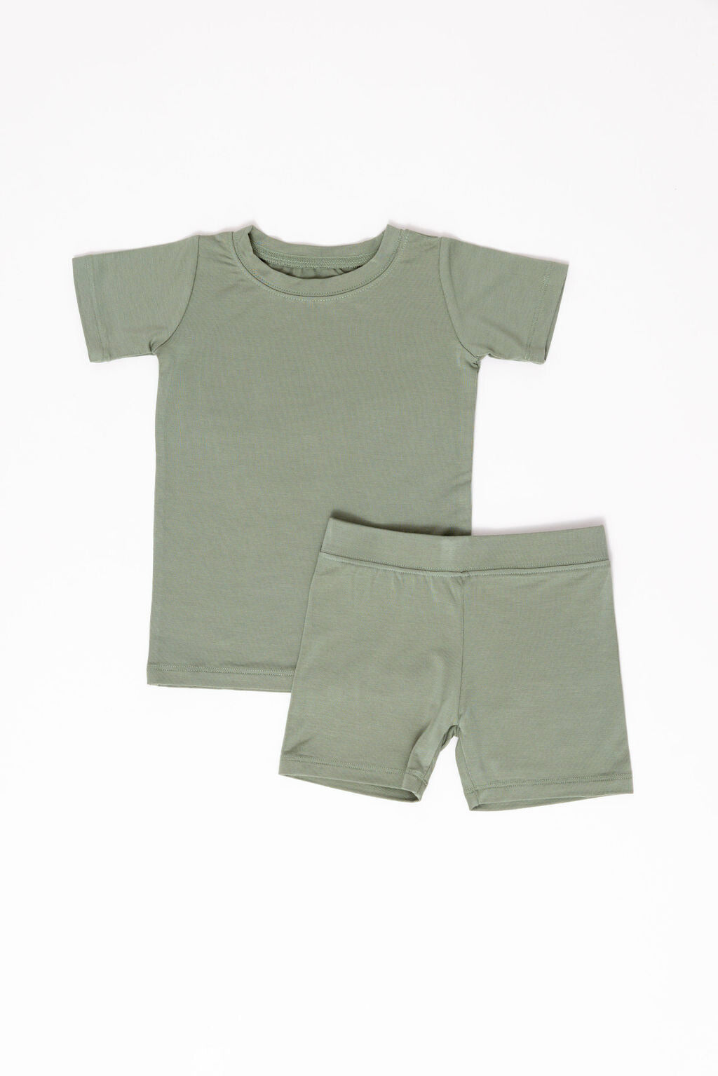 Toddler wearing a two-piece Sage Green CloudBlend™ short sleeve pajama set