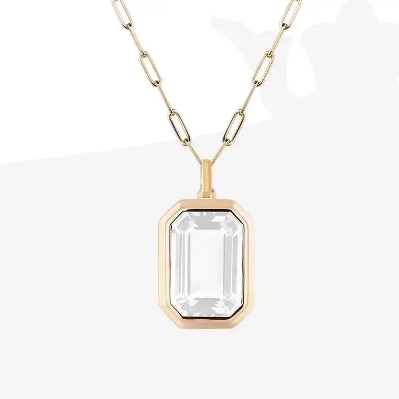 Molly Zircon Pendant Necklace with emerald-cut clear crystal in polished 18k gold plate on cable chain