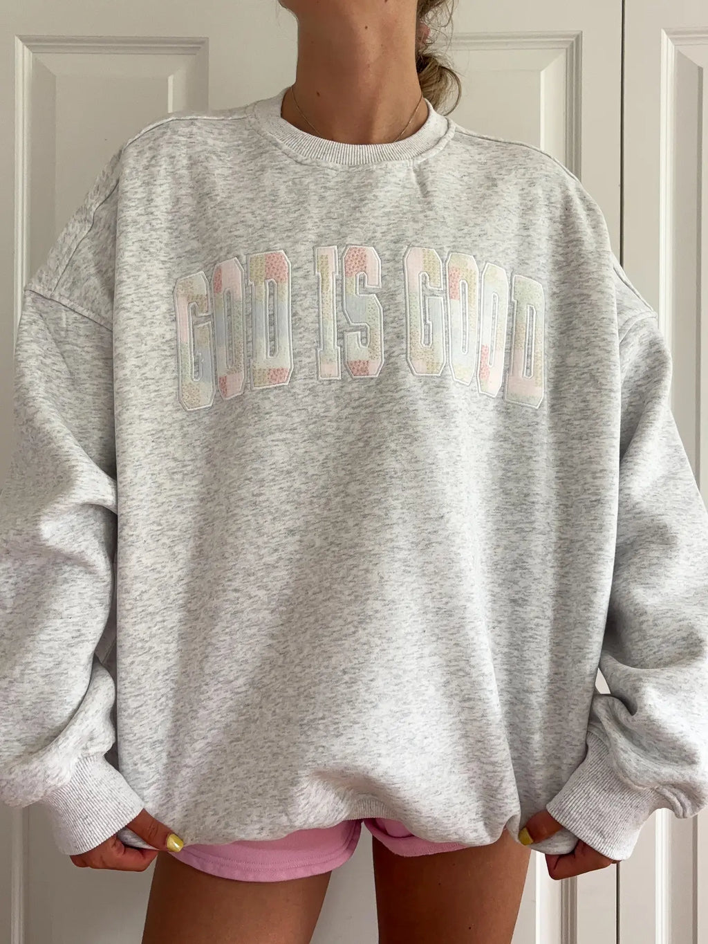 Close up of God Is Good Quilted Pastel Embroidered Sweatshirt showing texture and embroidery