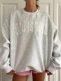 Close up of God Is Good Quilted Pastel Embroidered Sweatshirt showing texture and embroidery