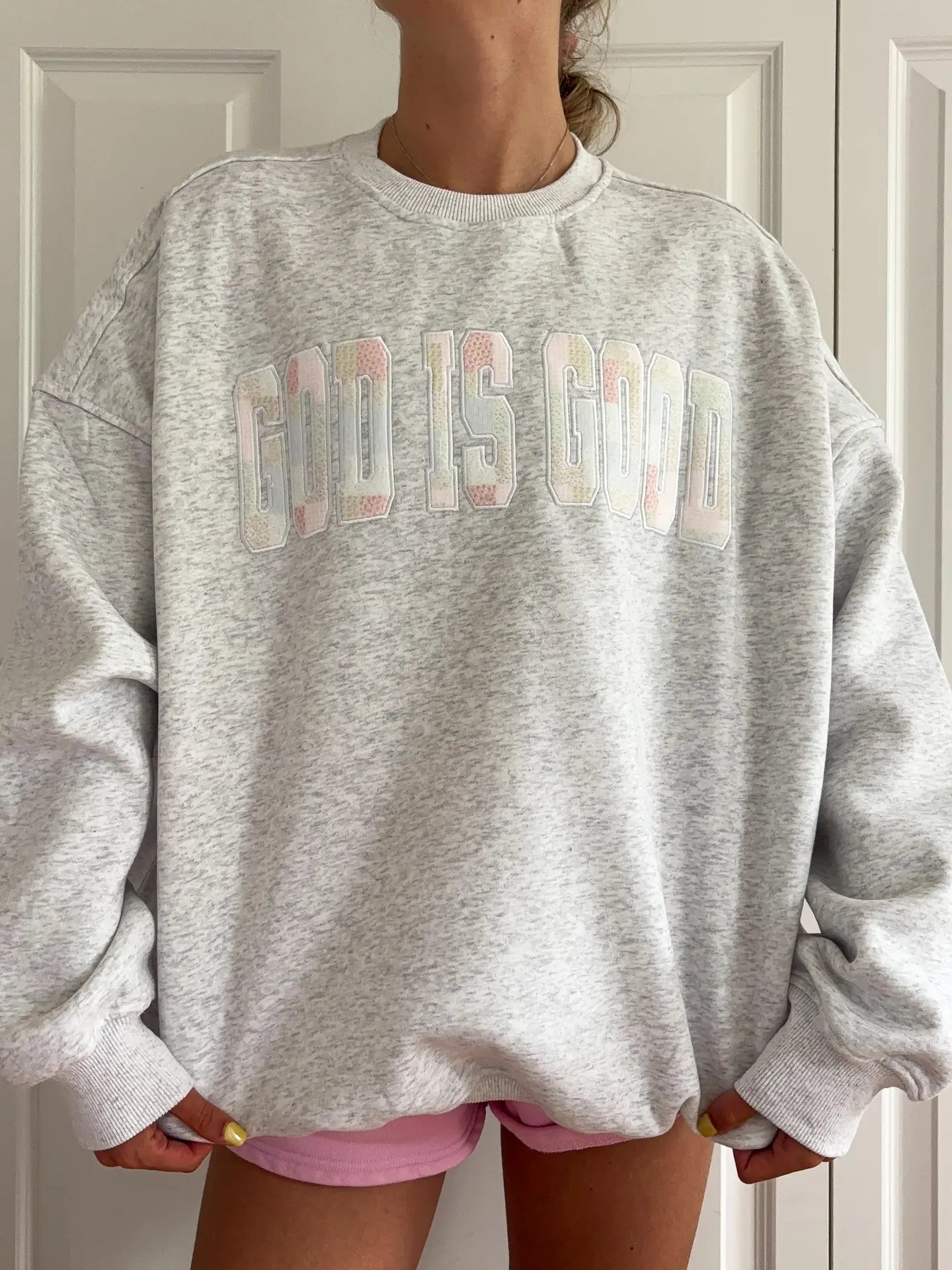 Close up of God Is Good Quilted Pastel Embroidered Sweatshirt showing texture and embroidery