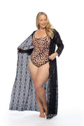 Model wearing a long sleeve black crochet maxi kimono beach coverup with a V-neckline and adjustable waist tie.