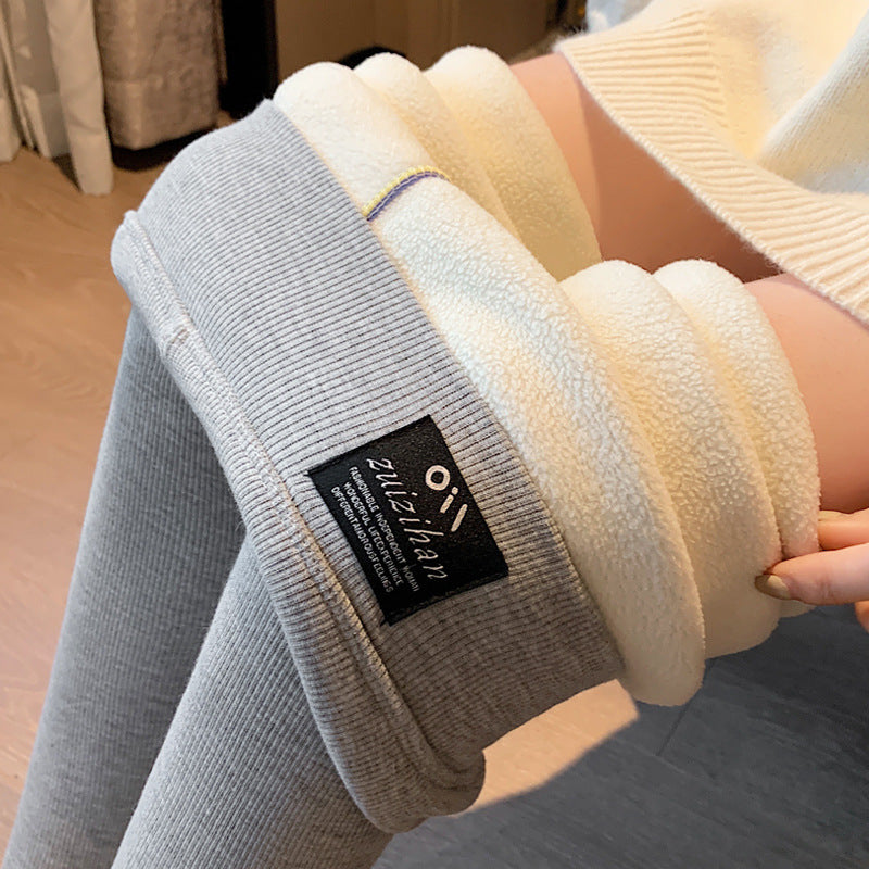 High-waist winter leggings with thick white lambswool fleece interior lining, shown in grey charcoal