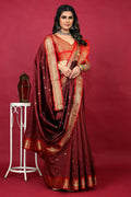 Jyoti Fashion maroon Paithani silk saree with detailed zari weaving and matching red blouse piece