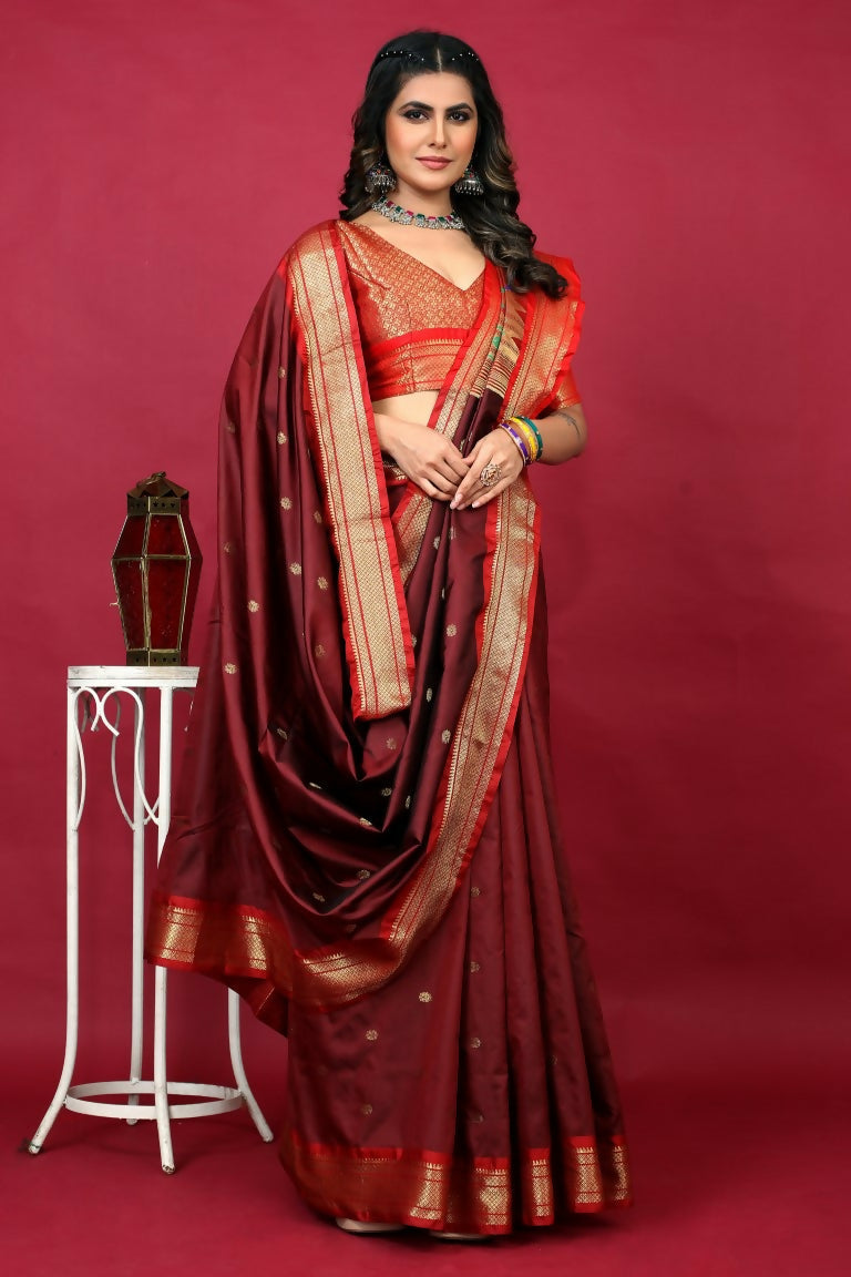 Jyoti Fashion maroon Paithani silk saree with detailed zari weaving and matching red blouse piece