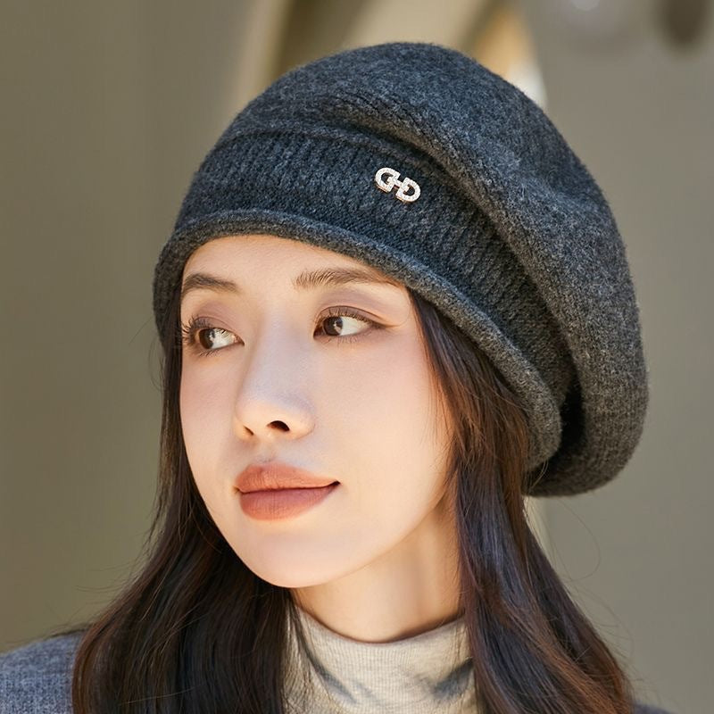 Model wearing a grey wool knitted winter beanie hat