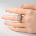 Wide band gold bohemian ring with pave set cubic zirconia stones