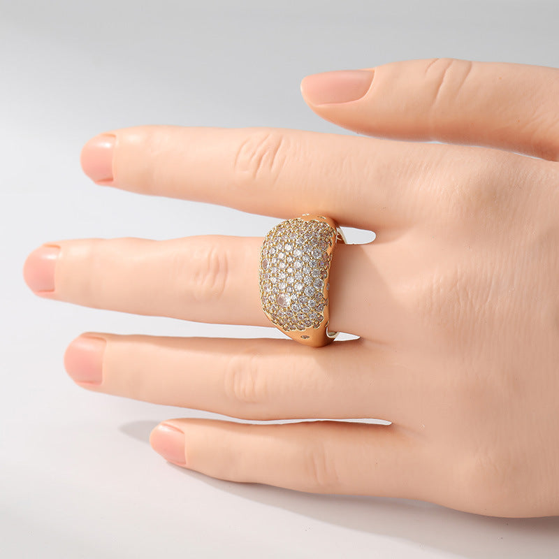 Wide band gold bohemian ring with pave set cubic zirconia stones