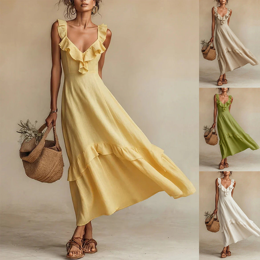 A woman wearing a sleeveless ruffle maxi dress with a high-waist design.