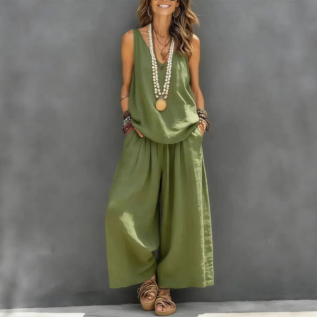 A woman wearing a two-piece set consisting of a sleeveless tank top and matching wide-leg pants in olive green and white color options.