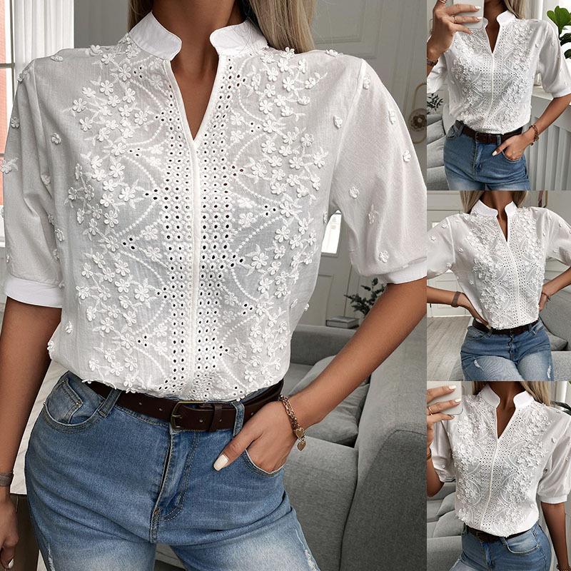 Model wearing a white V-neck stand collar blouse with intricate floral lace embroidery