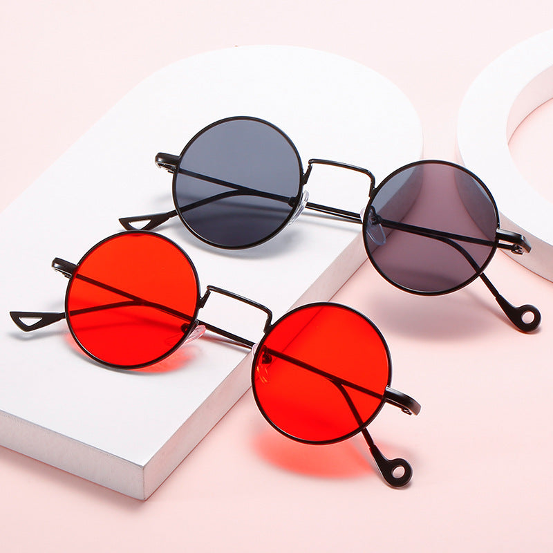 Steampunk-inspired round sunglasses with metallic frames available in black, red, silver, yellow, and blue.