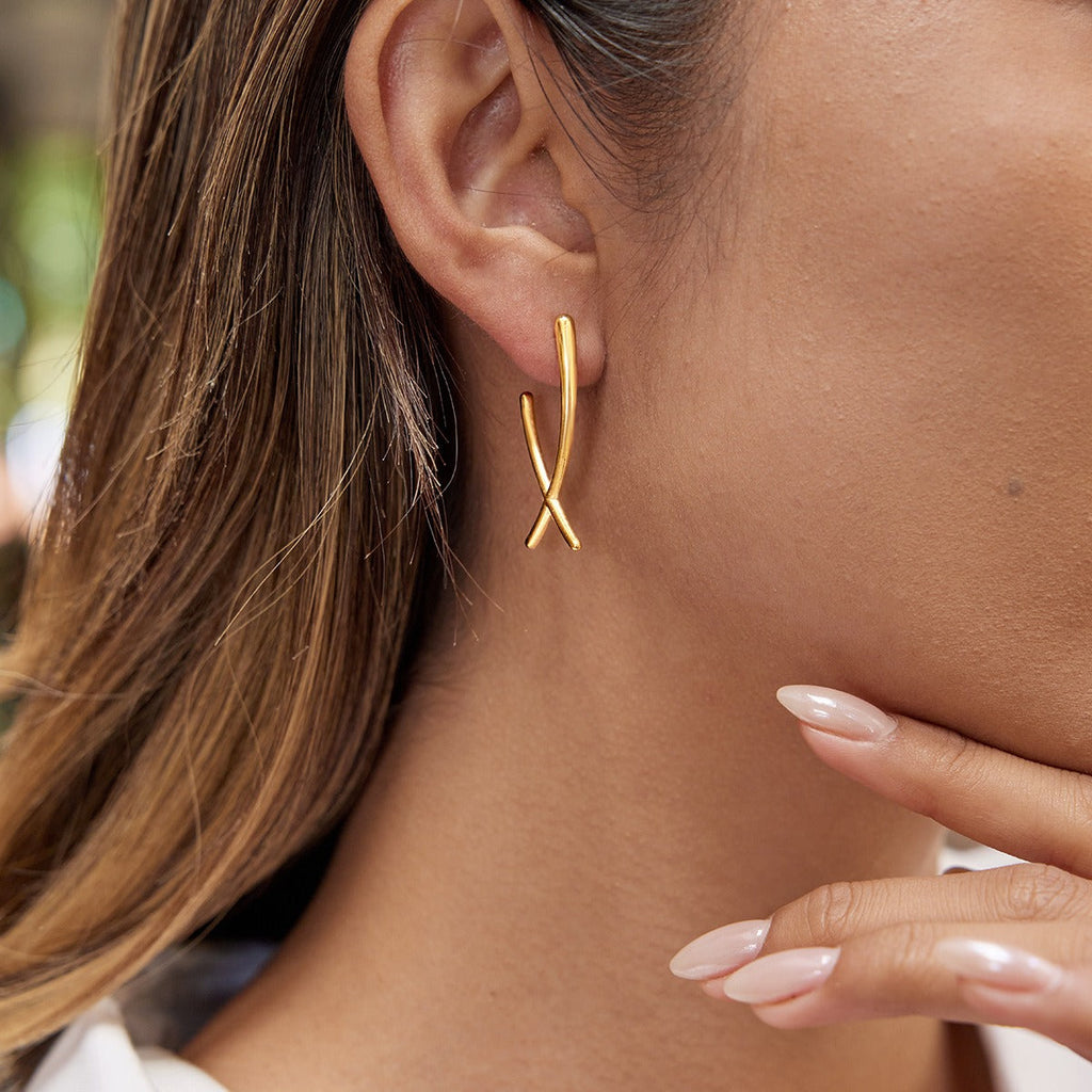 Minimalist 18K gold plated cross earrings made from titanium steel