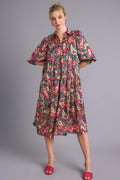 A beautiful printed satin midi dress with a tiered design in vibrant colors