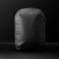 A sleek black Vincero Collective Commuter backpack in the Stealth colorway, shown from a front-facing perspective.