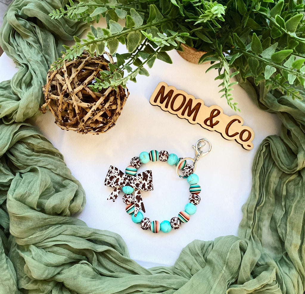 Western Brown Cowprint Bow Bead Wristlet