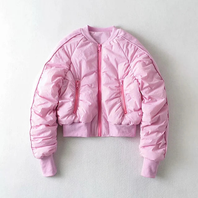 Women's pink cropped bomber jacket with zippered pockets, front view.