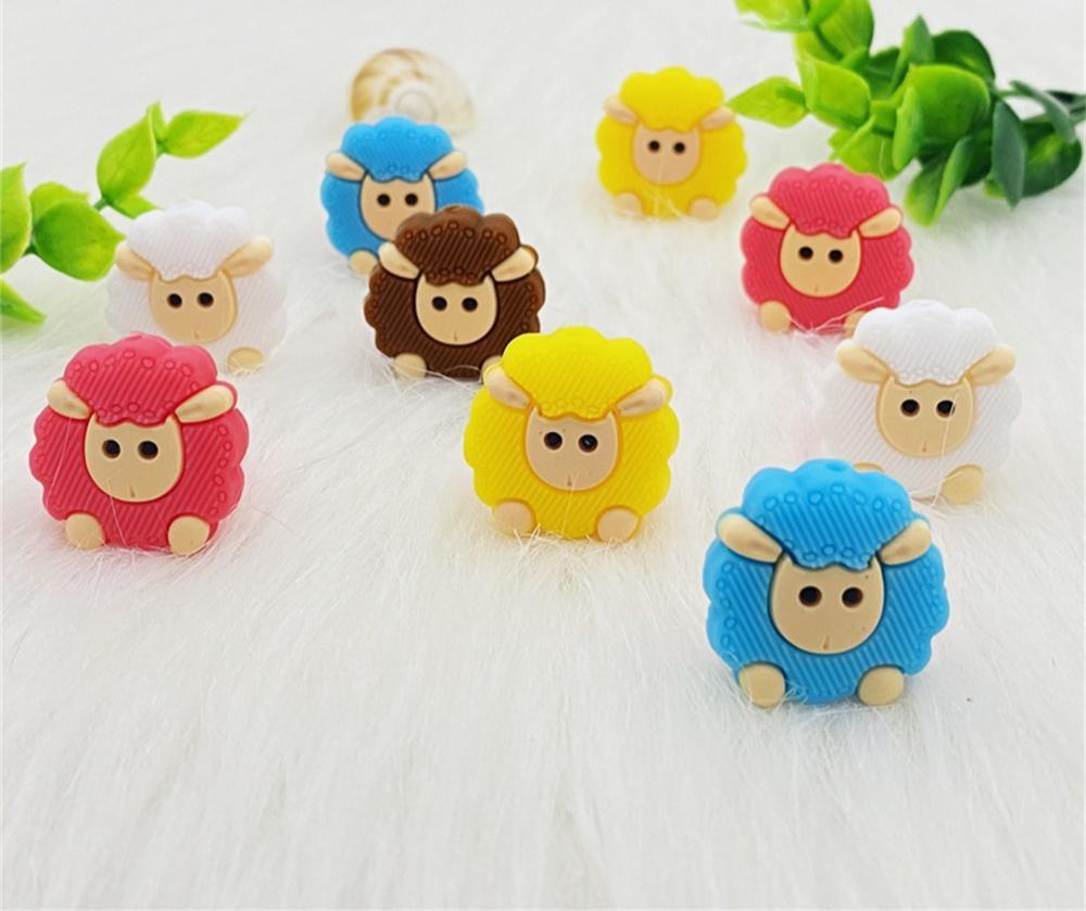 Set of 5 colorful animal-shaped silicone teethers for babies in white, yellow, blue, pink, and brown.