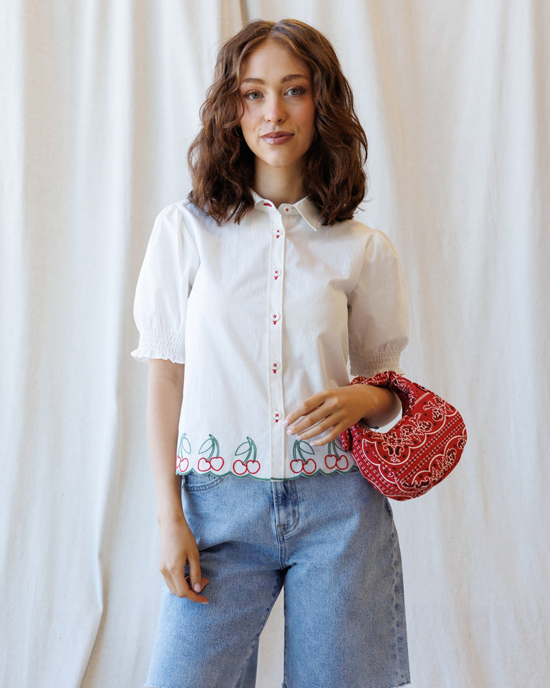 Cherry Cute Button Down blouse in white cotton with short puff sleeves and cherry embroidered scallop hem