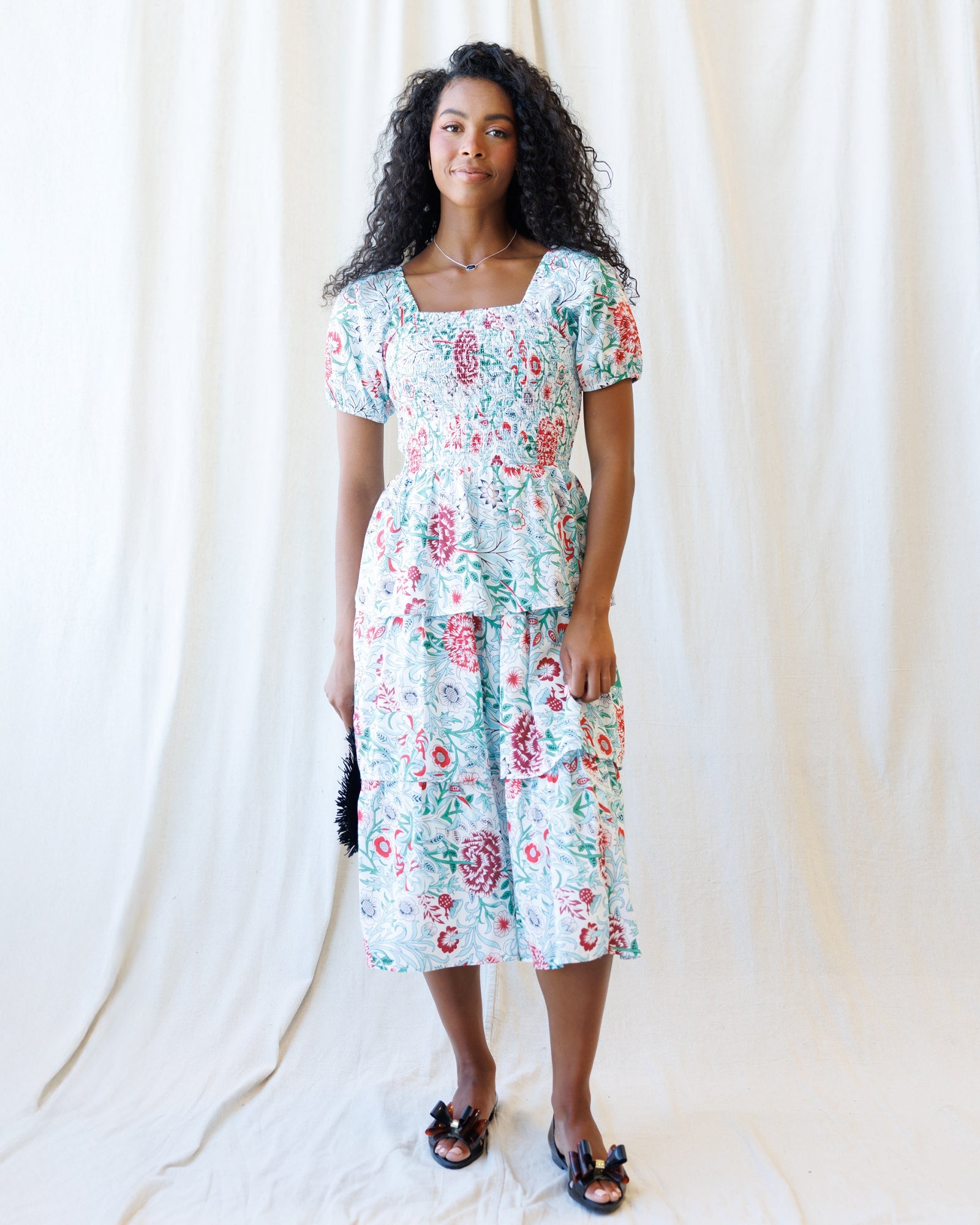 Close up of the Complimentary Colors floral print midi dress with smocked bodice and layered skirt