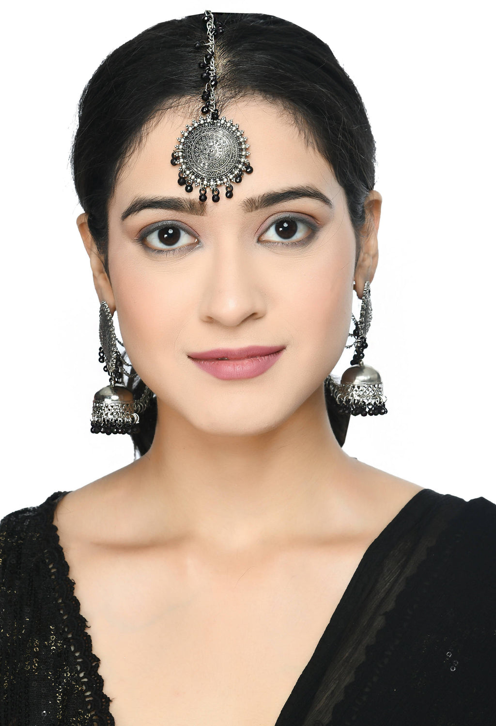 Regal Bahubali style black bead earrings with a matching traditional Tikka.