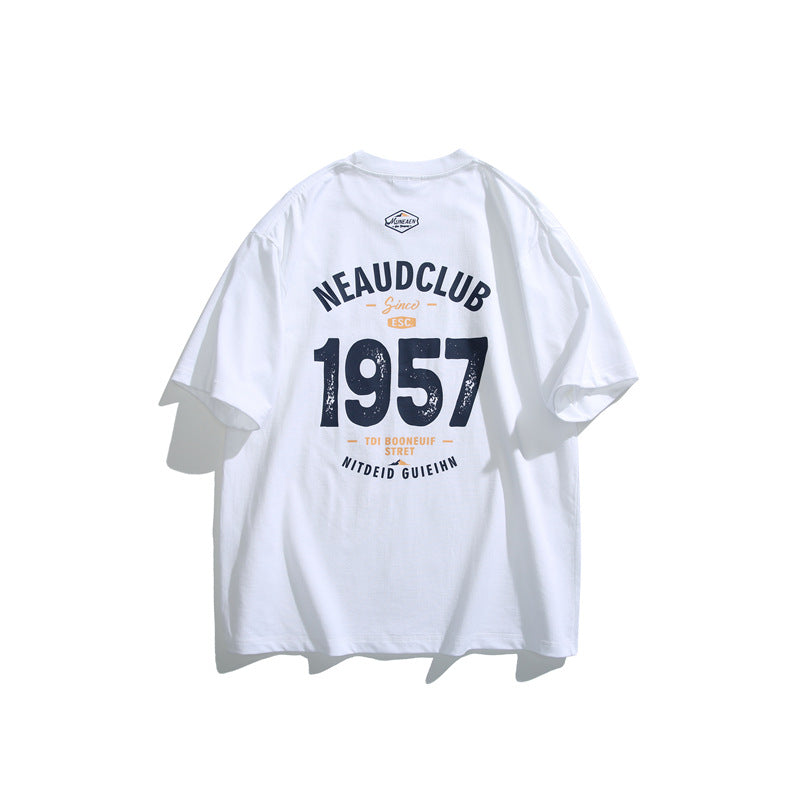 Back view of a white loose casual T-shirt featuring a large black and orange 1957 graphic print and front chest detail.