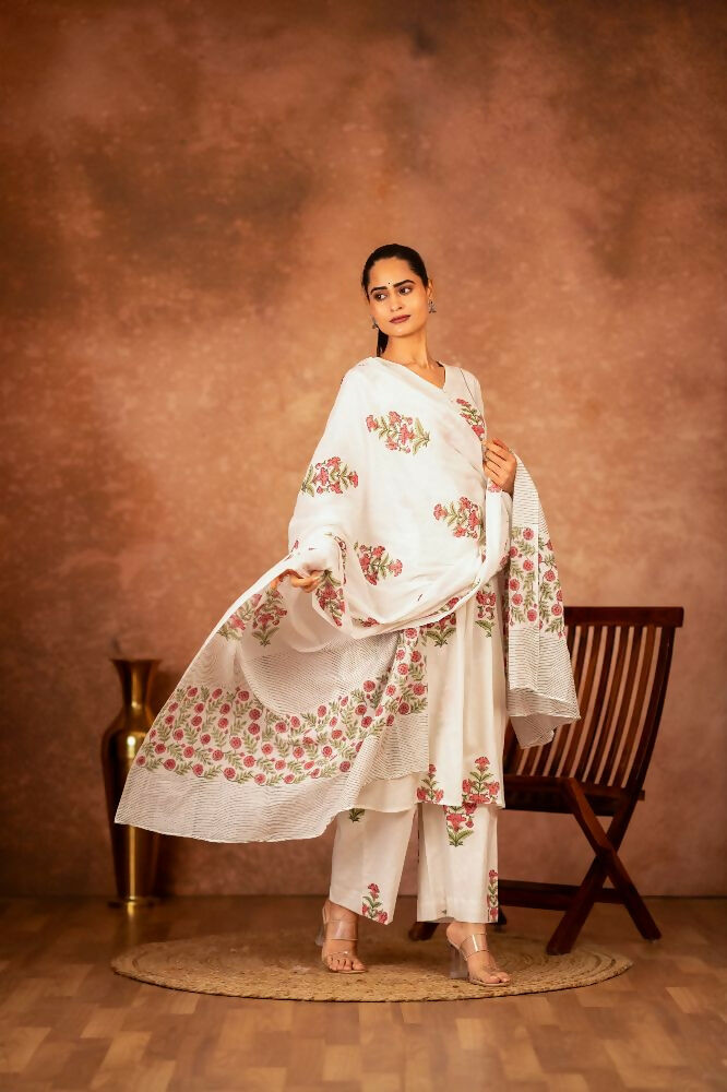 Model wearing an off white and pink hand block printed cotton suit set