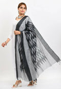 Close up of black handloom cotton Ikkat dupatta with traditional woven patterns