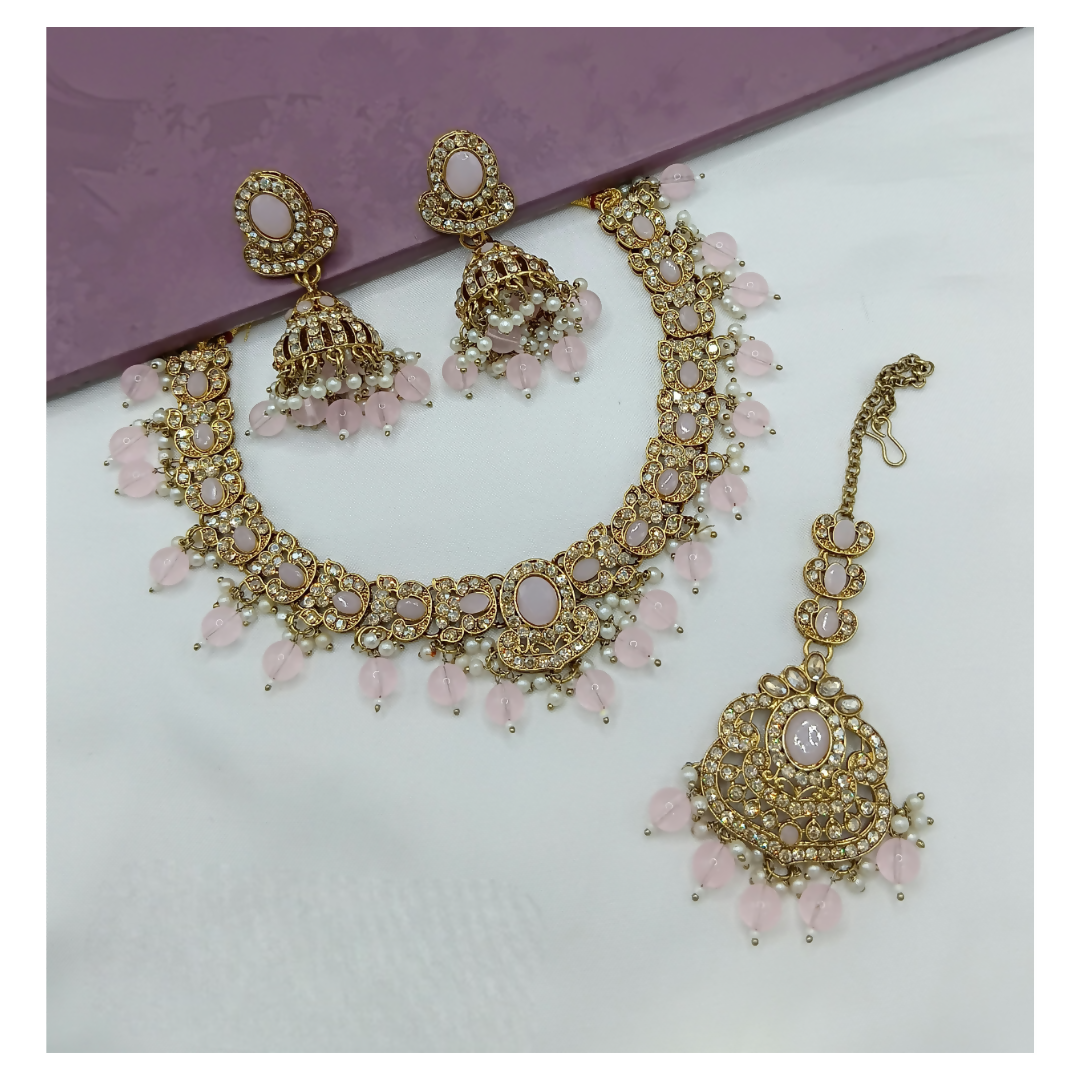 Delicate light pink stone work necklace set with matching earrings.