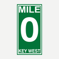 A green and white Mile 0 Key West sign printed on a velour beach towel.