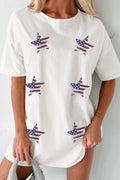 A woman wearing a white oversize t-shirt with sequin stars in a USA flag pattern.
