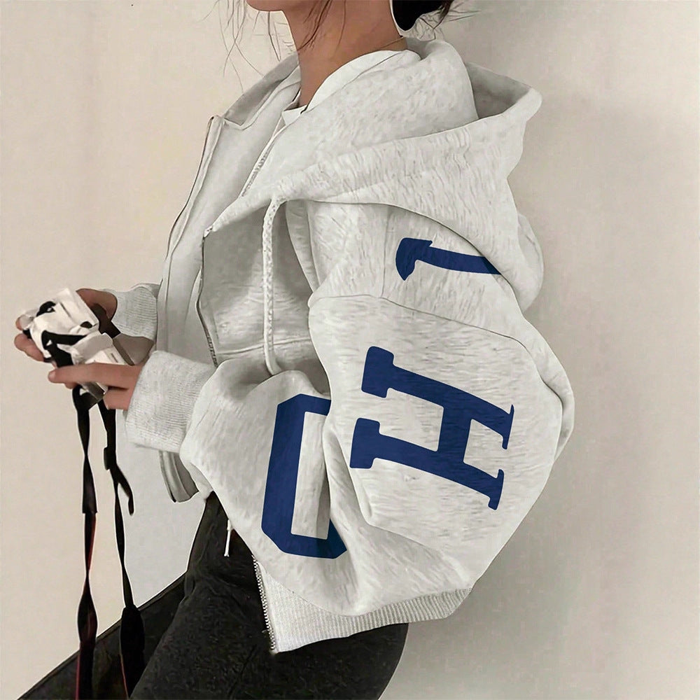 Women's casual long sleeve zip-up sweatshirt with a stylish modern print design.