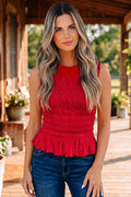 Solid red sleeveless tank top with a ruffle hem and shirred detailing.