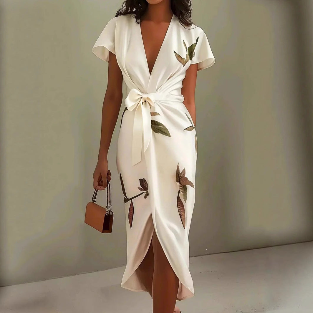 A romantic V-neck short-sleeved satin dress with digital prints and lace-up waist detail