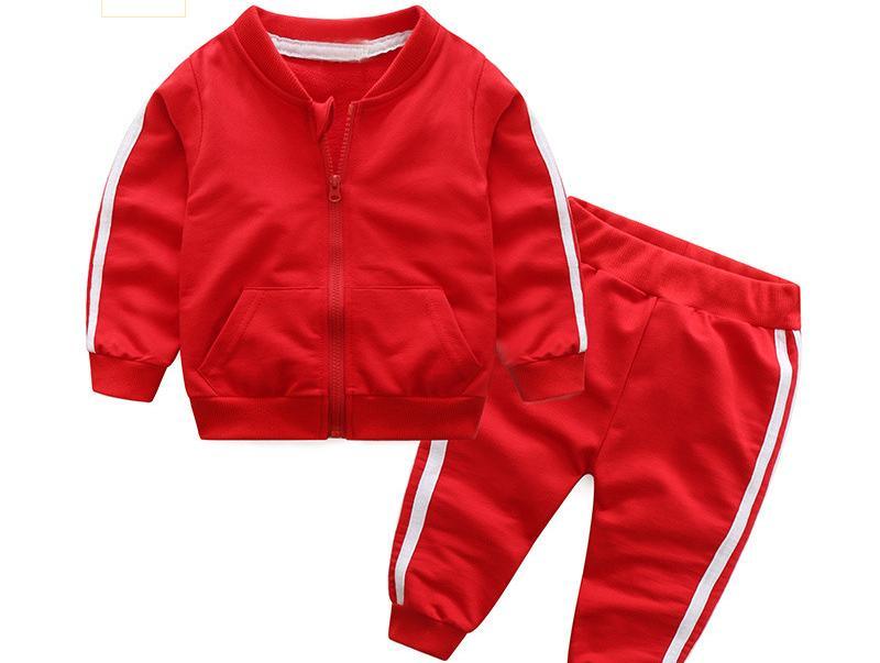 Baby wearing a sporty cotton tracksuit set with a hooded zipper jacket and matching pants.